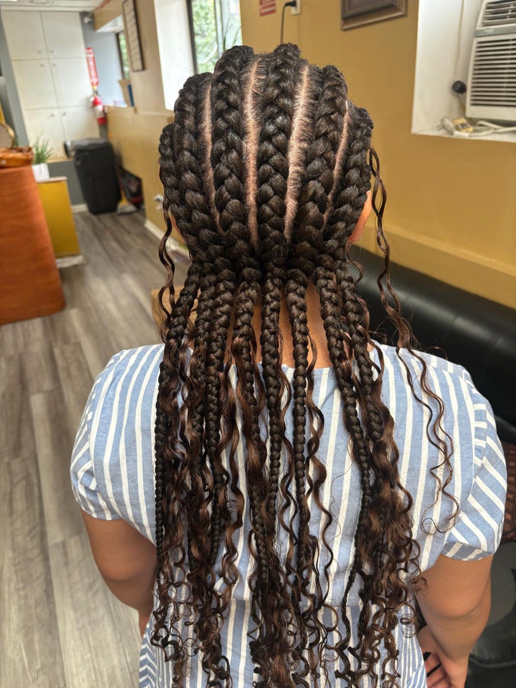 Long boho feed-in braids with curls by Aoua's Braids