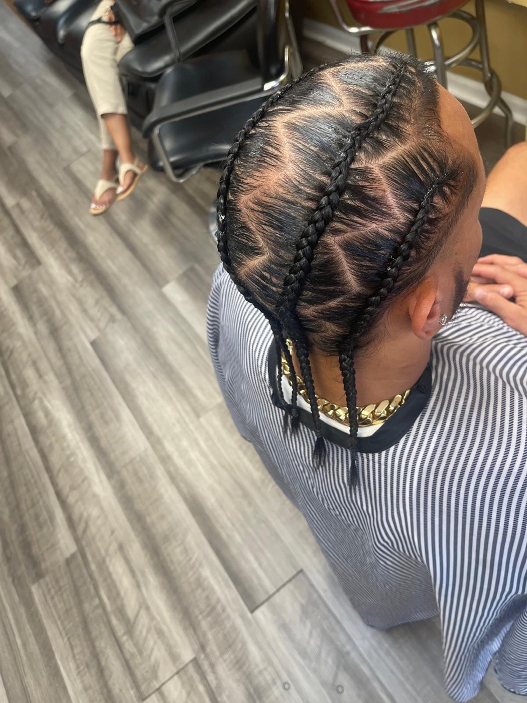 Neat cornrows with clean curved parts by Aoua's Braids