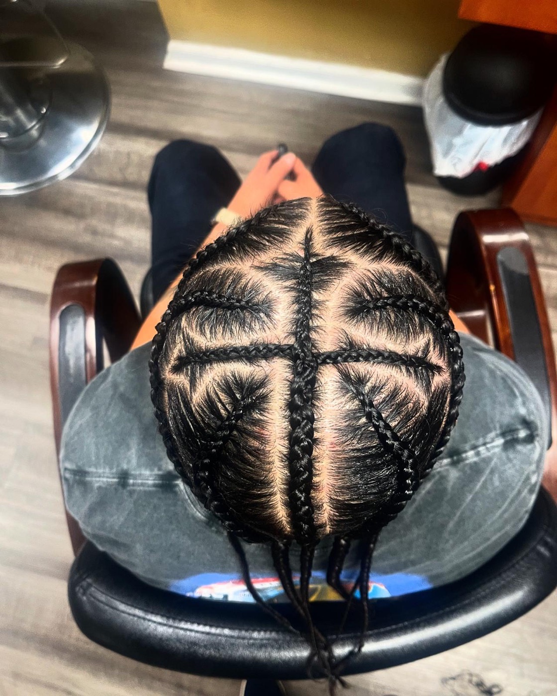 Detailed freestyle cornrow design by Aoua's Braids