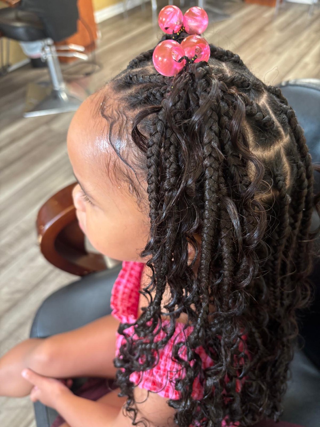 Boho braids with curly ends and pink beads by Aoua's Braids